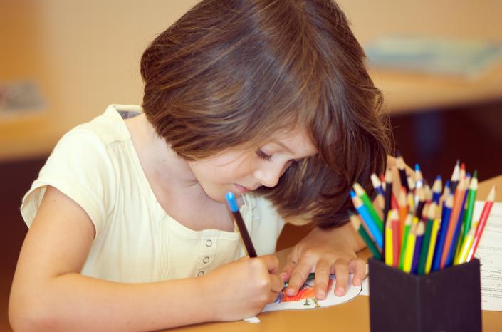 A child drawing a picture.